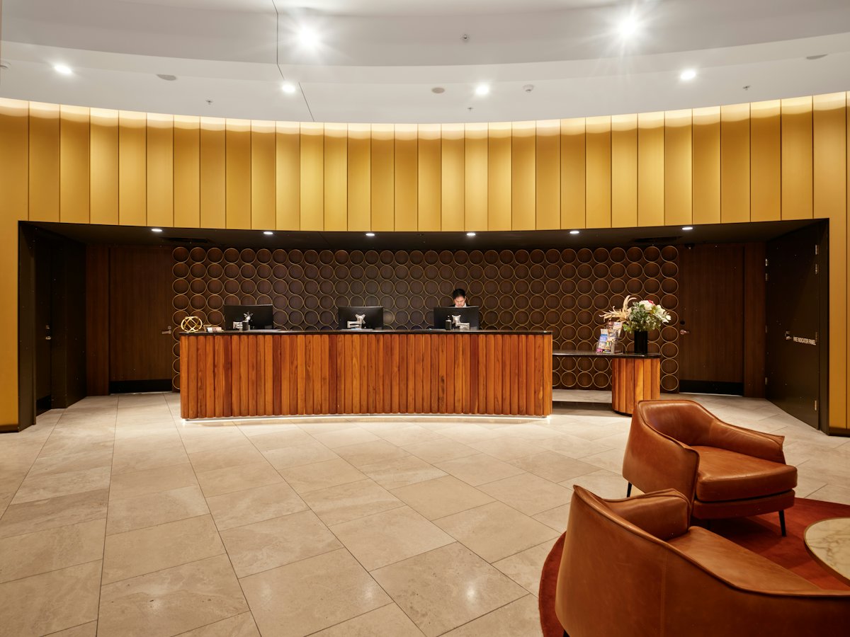 A hotel reception with a welcome display
