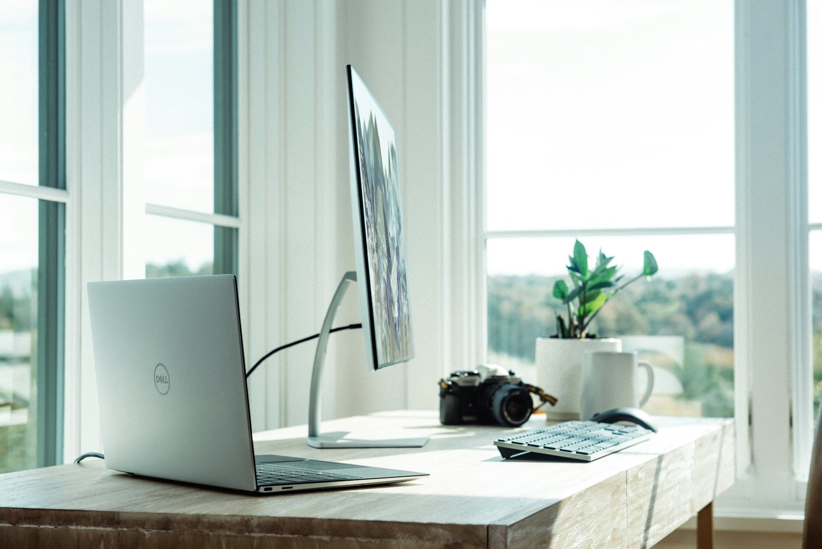 A desk with a monitor loading a web page full screen