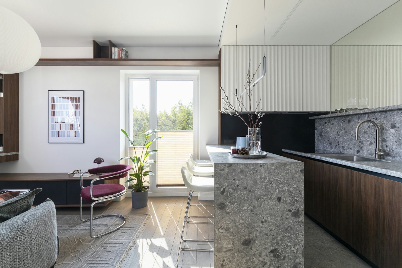 A bright apartment with a guest information display by the door